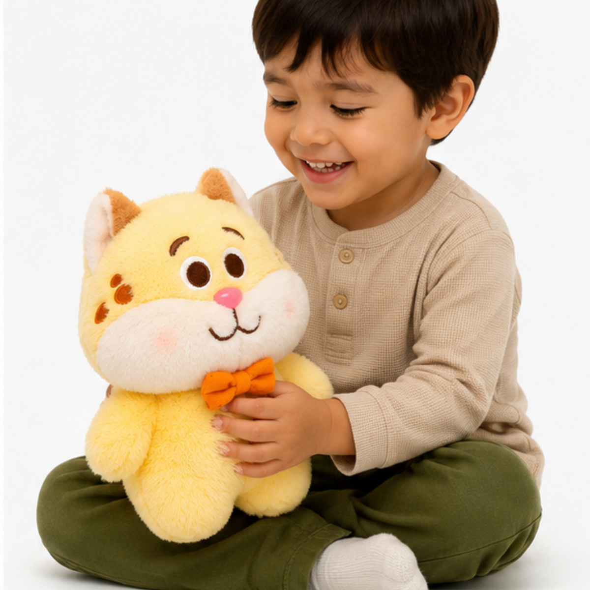 A yellow plush cat toy with an orange bow tie.